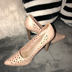 Restricted beige/nude colored pumps